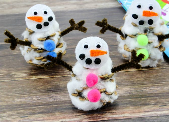 Image of three pinecone snowman crafts.
