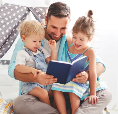 Dad reading to kids