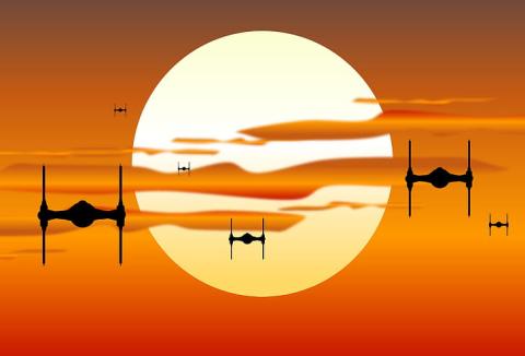 Image of X-wing fighters flying in front of a sun