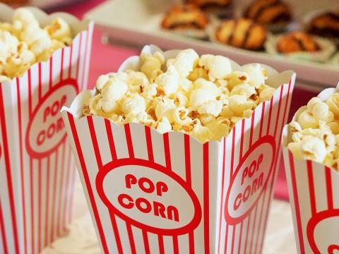 An image of popcorn in a popcorn bucket. 