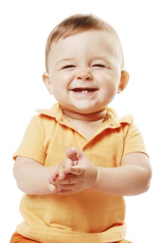 Image of a baby clapping at storytime.