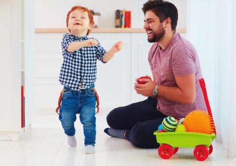 Laughing child with father