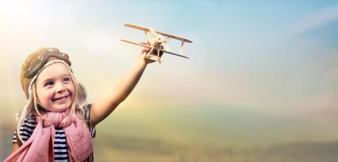 Girl with toy airplane