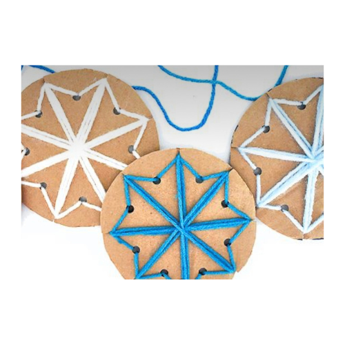 Image of snowflakes woven on cardboard template. 