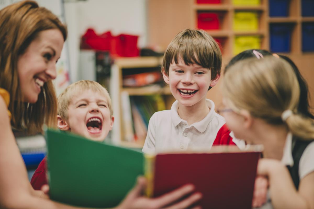 An image of preschoolers laughing.